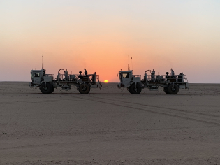 nomad 65 neo product on desert with sunset